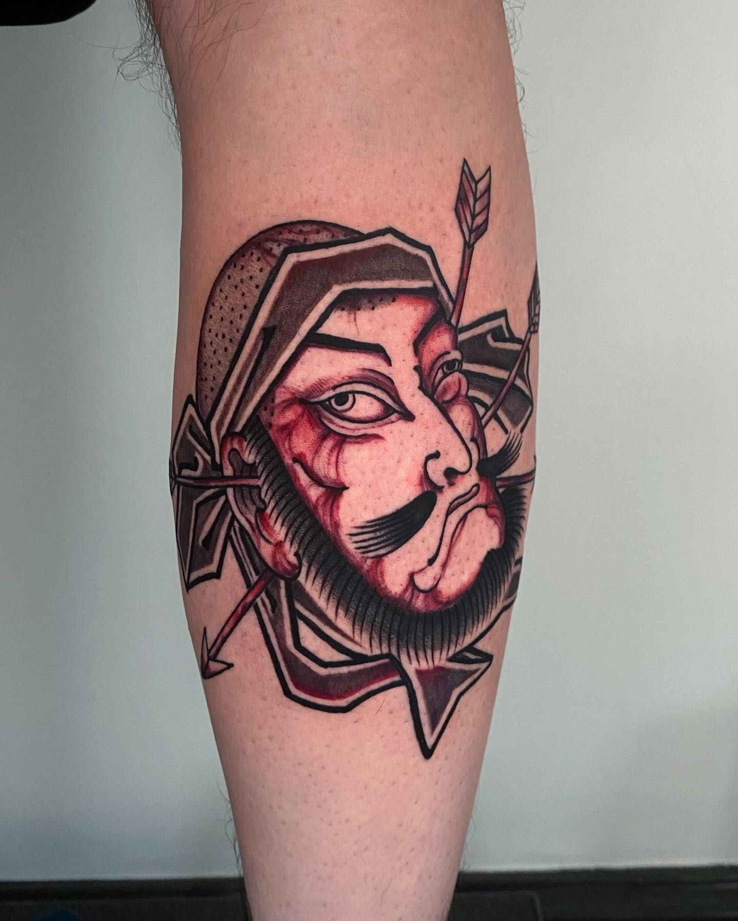 Mask with arrow American traditional tattoo on the forearm by H O R I H A N