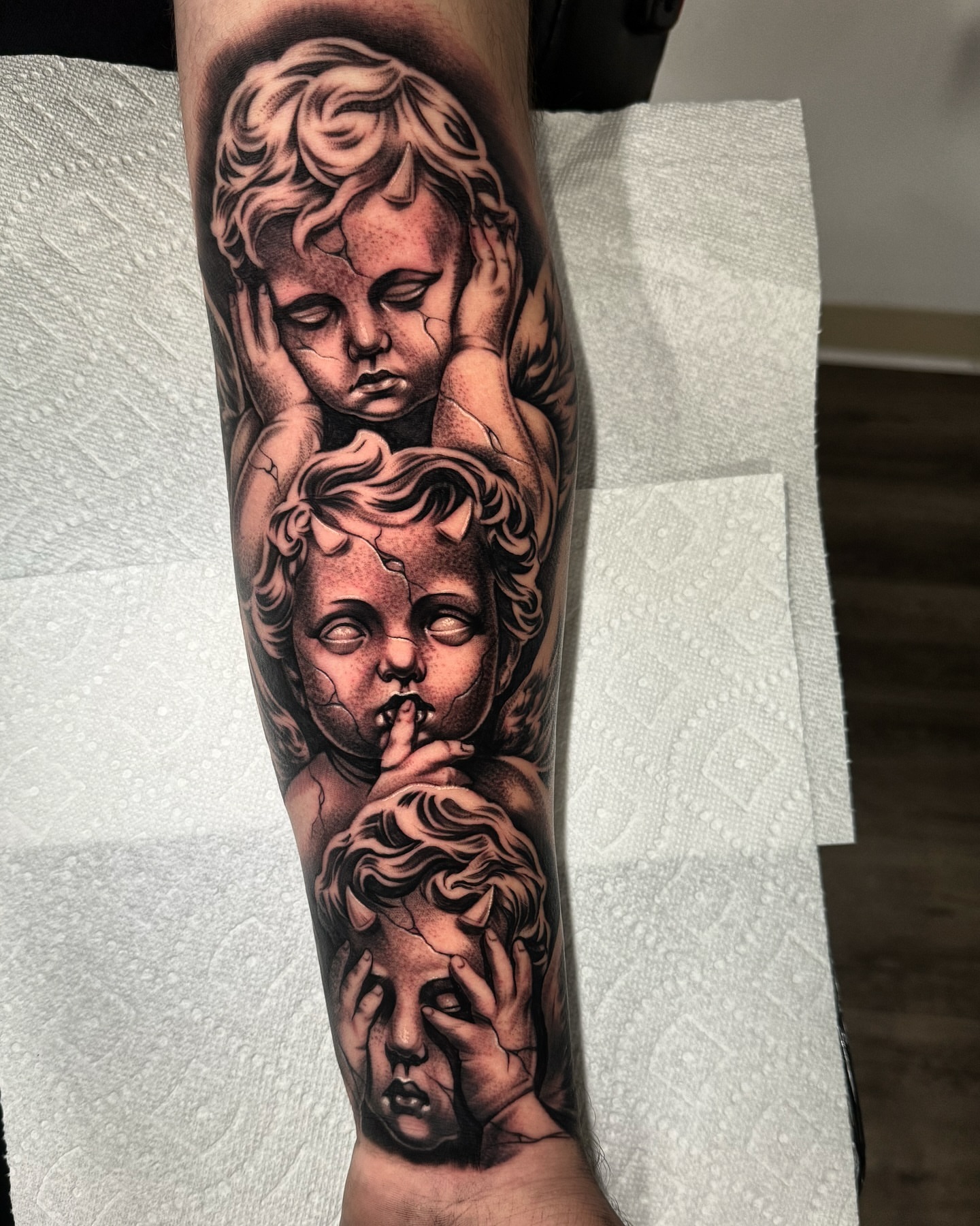 Cherubs realism tattoo on the forearm by eksoe_