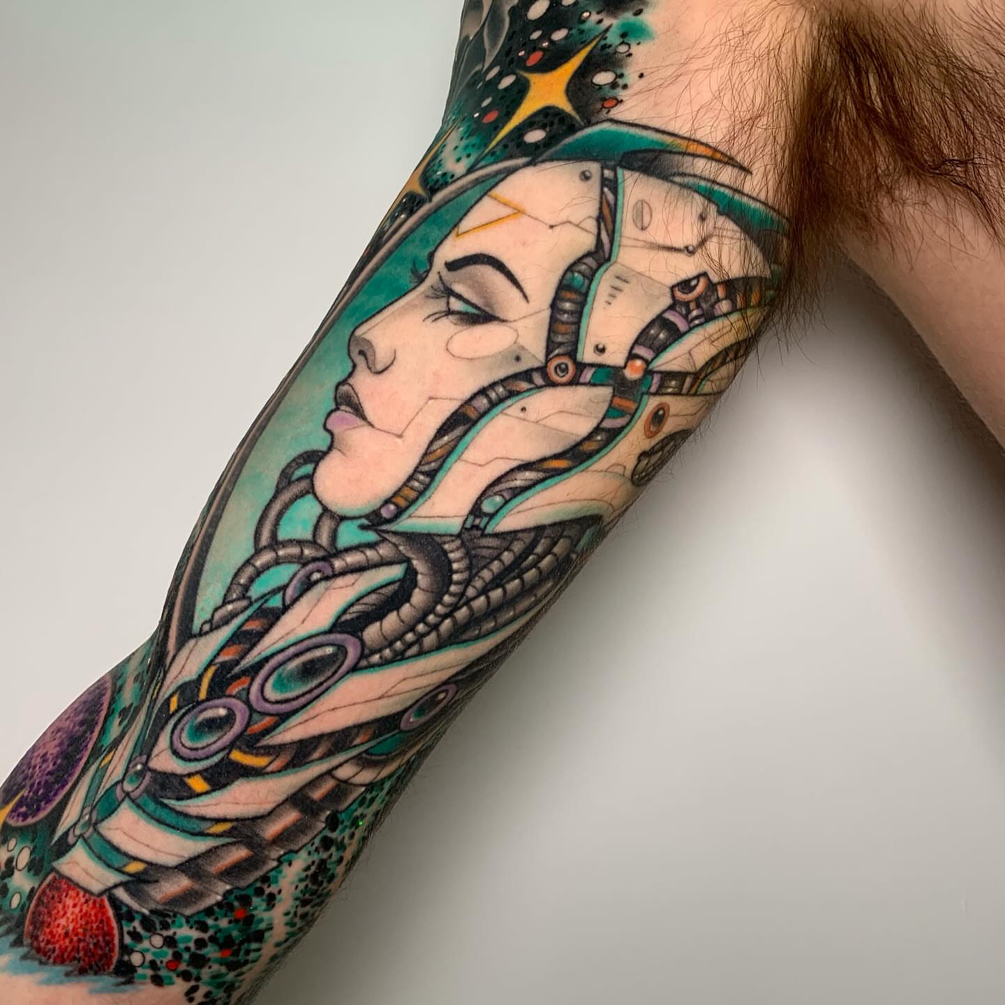 Cyborg woman geometric tattoo on the forearm by Patrick Whiting