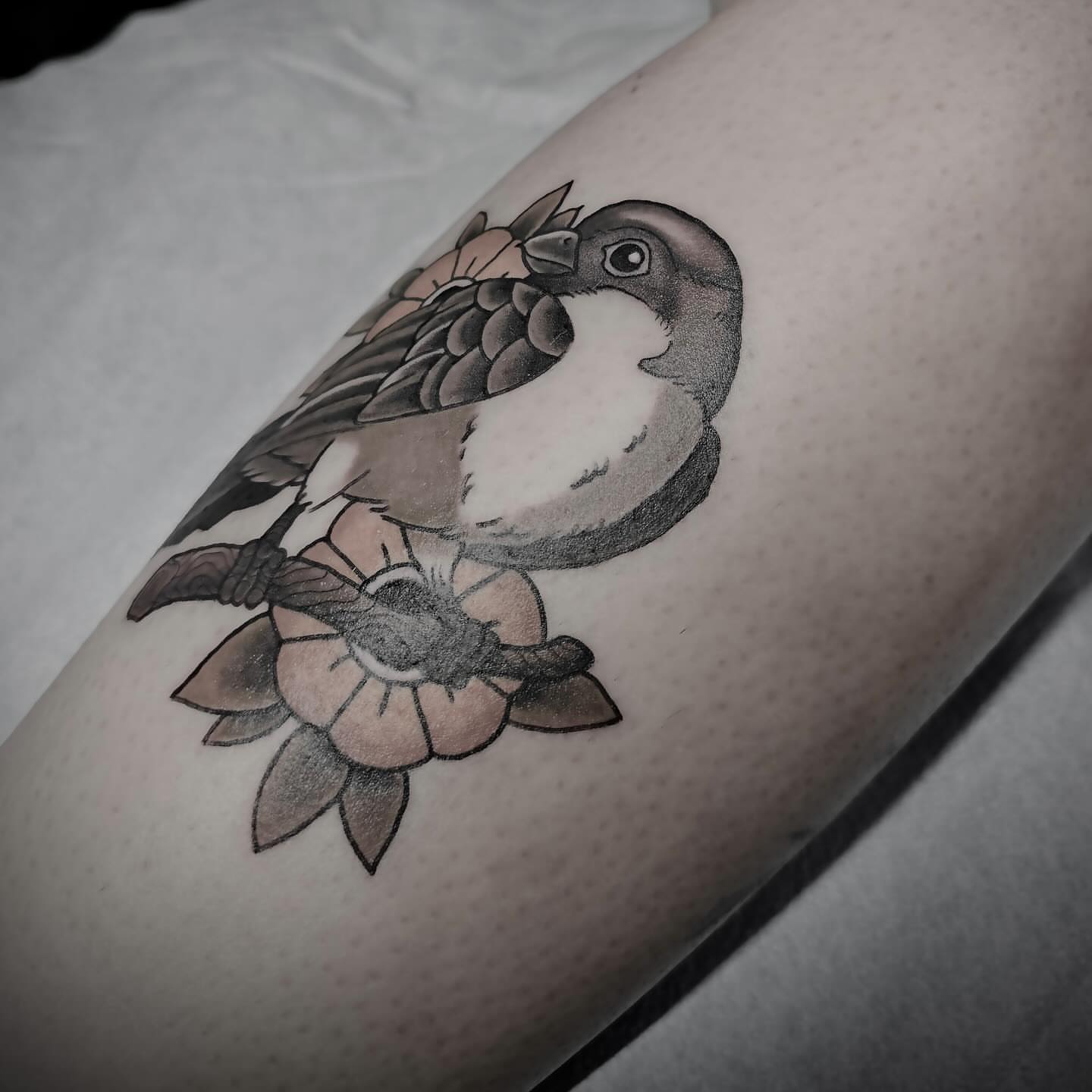 Sparrow and lotus American traditional tattoo on the forearm by J. Arturo Laparra