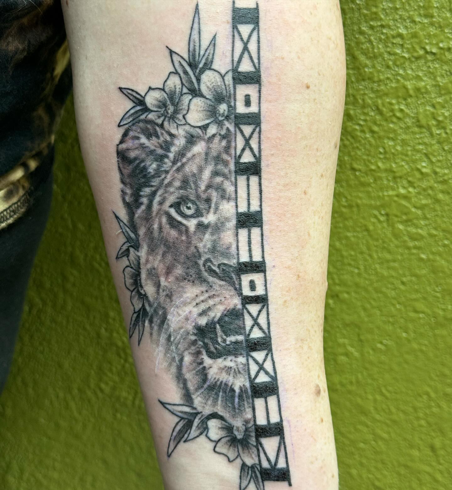 Lion realism tattoo on the forearm by Chris Allen Taylor