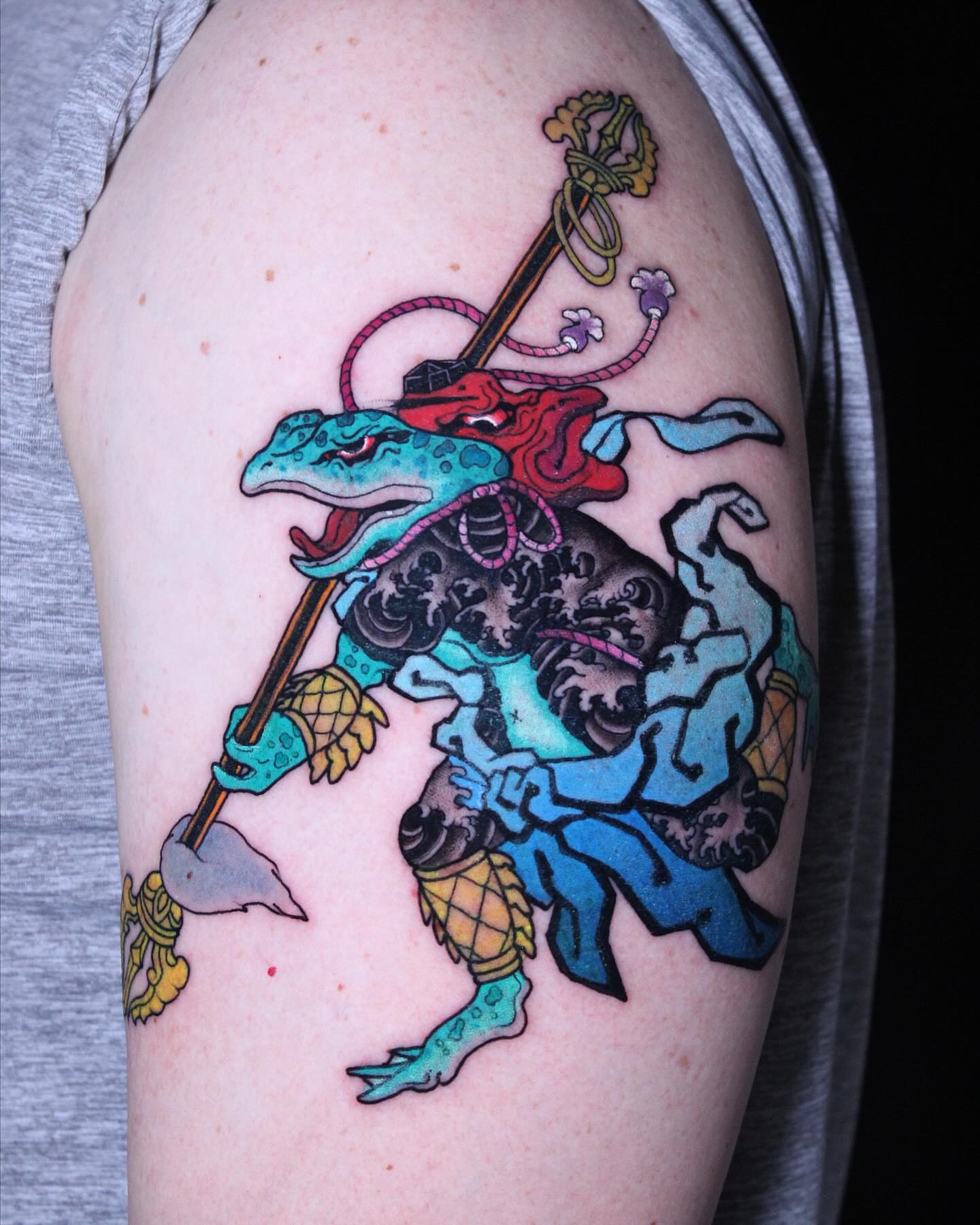Frog warrior new school tattoo on the upper arm by Alezumie