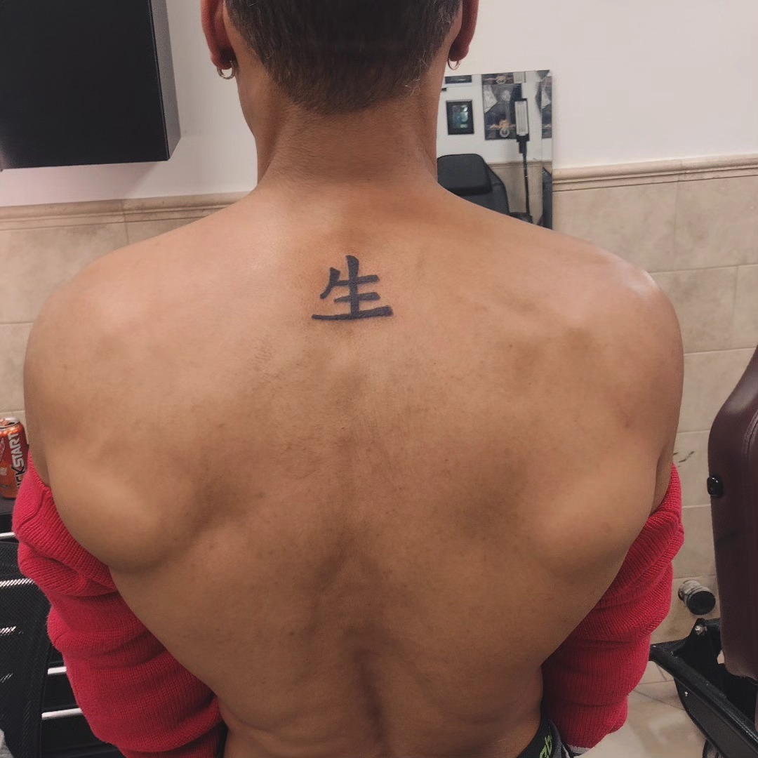 Chinese character black and grey tattoo on the back by Lopez Dautruche