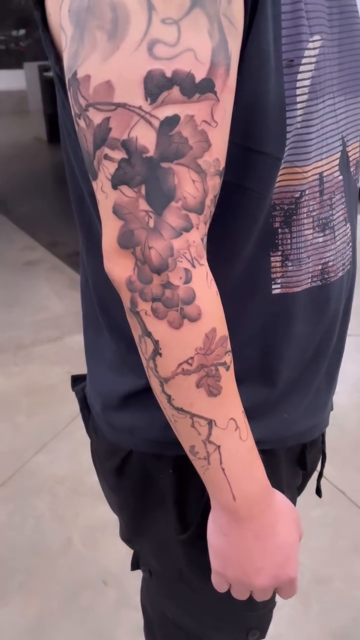Grapes and vine realism tattoo by Georgia Grey