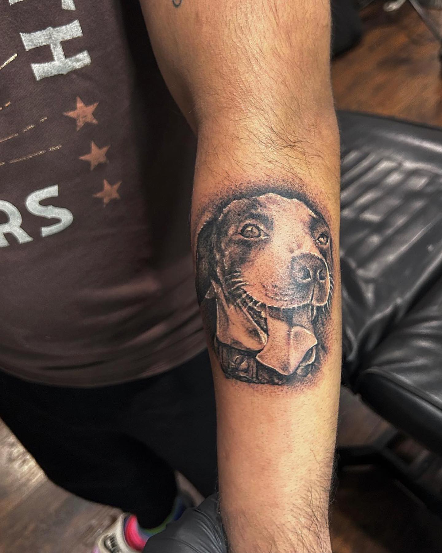 Dog realism tattoo on the forearm by Visionary Tattoos