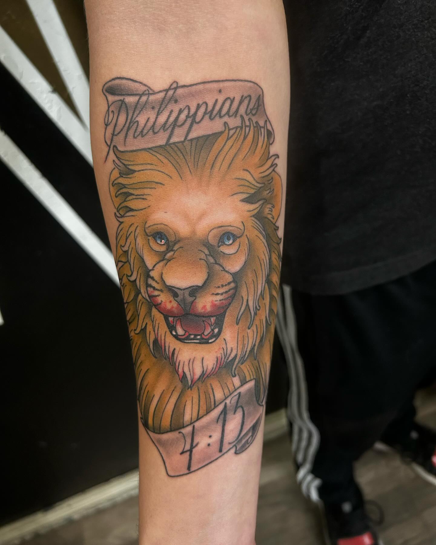Lion realism tattoo on the forearm by Sean Cavanaugh