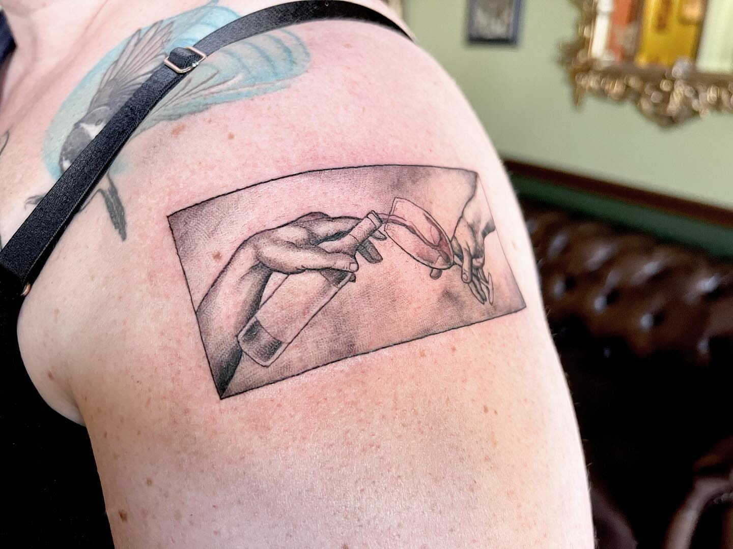 Hands realism tattoo on the shoulder by Tattoos by Alli Wilcox