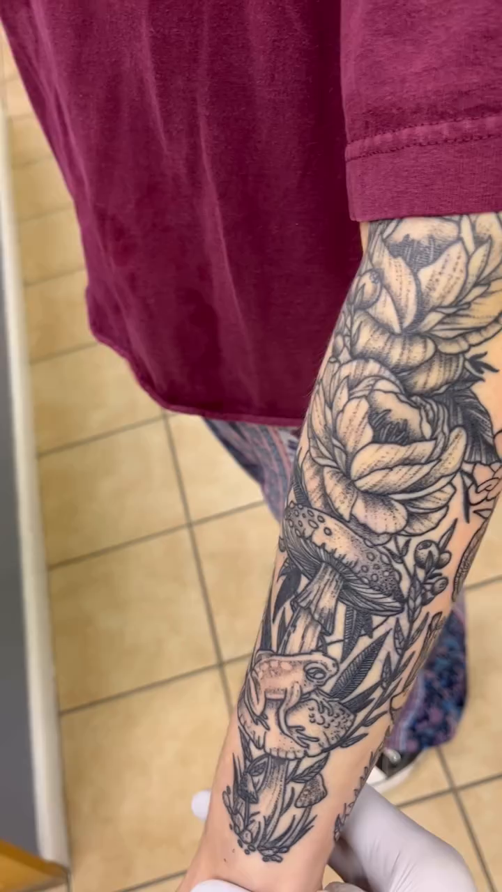 Rose and snake sleeve realism tattoo by Adam Silfies