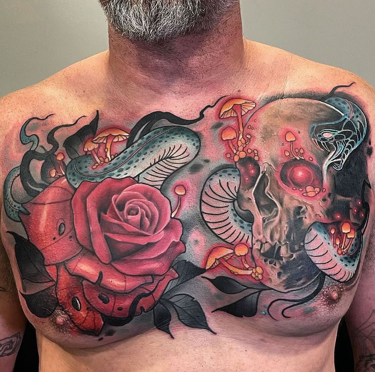 Skull and roses dark realism tattoo on the chest by Mary Blake Tattoos, Franklin, Tennessee