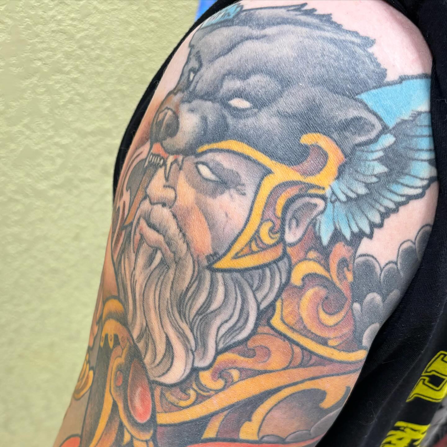 God-like figure American traditional tattoo on the shoulder by Rene Chavira