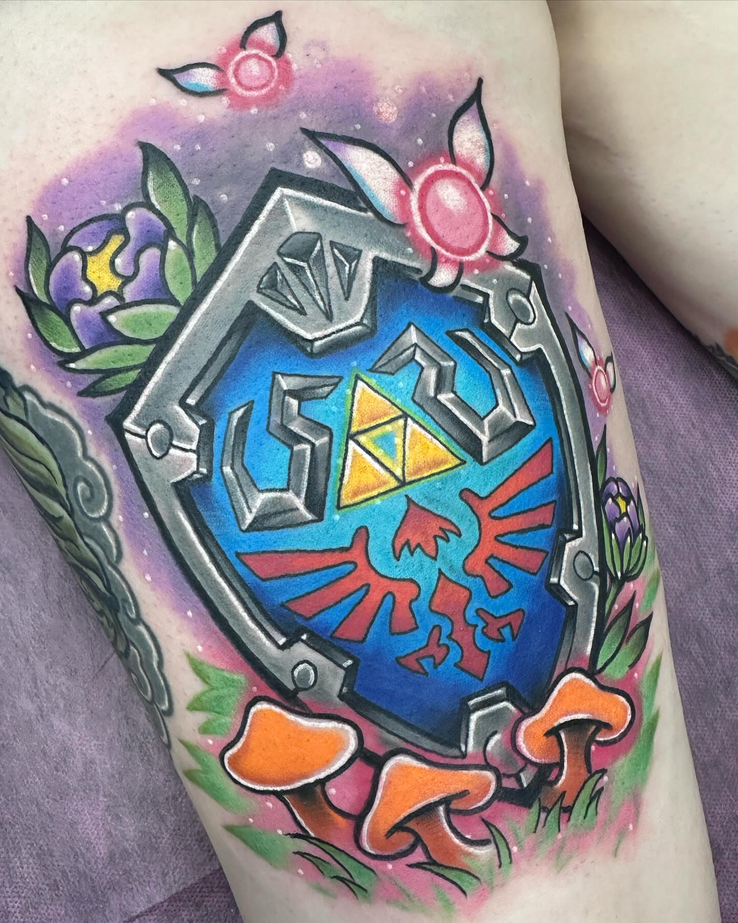 Hylian Shield geometric tattoo on the thigh by Jeremy Thomas