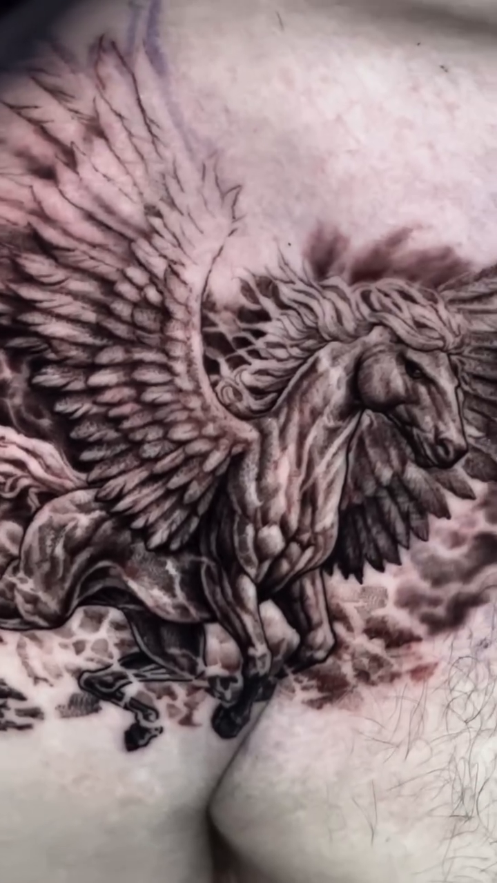Pegasus in clouds realism tattoo by James Moyer