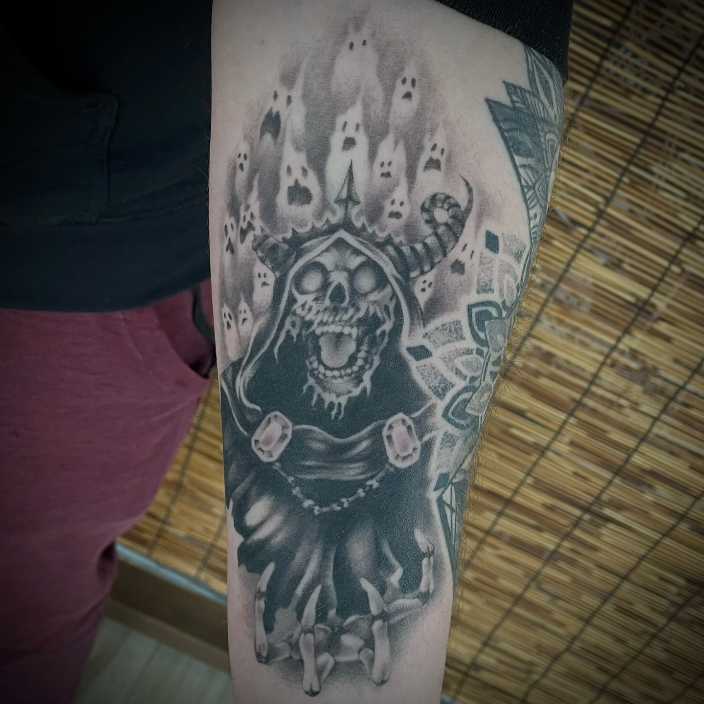 Skull with ghostly flames dark realism tattoo on the forearm by Brianna, Portland, Oregon