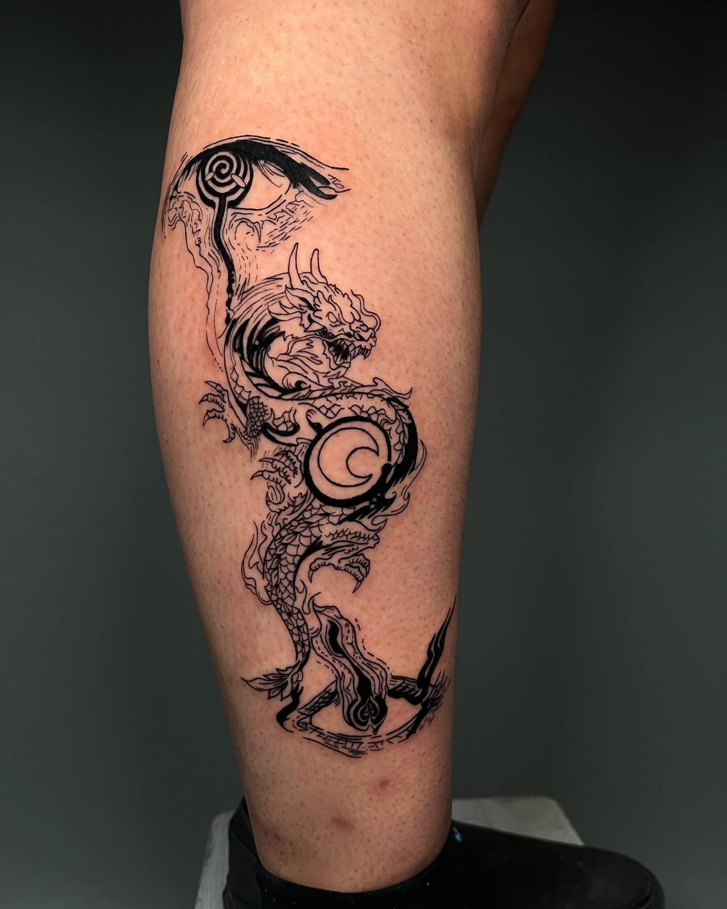 Dragon black and grey tattoo on the calf by Anthony “Jiinky” Quintanilla 🧸☁️