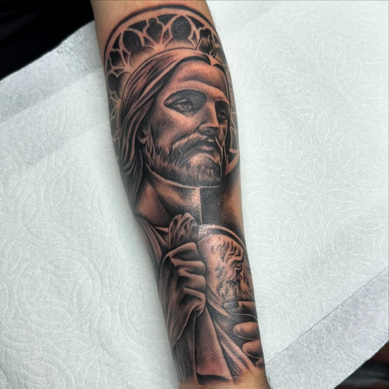 Religious figure realism tattoo on the forearm by Yari, Los Angeles, California