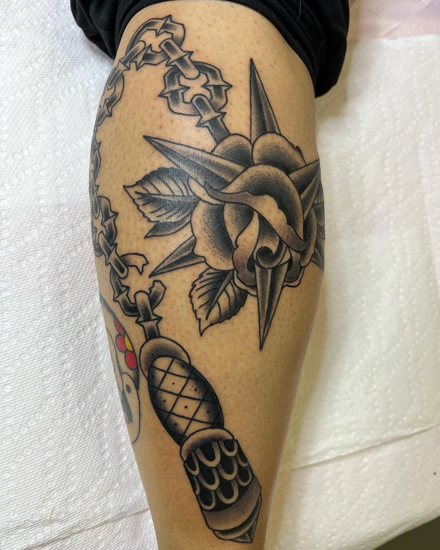 Rose and dagger American traditional tattoo on the thigh by Pedroux M.