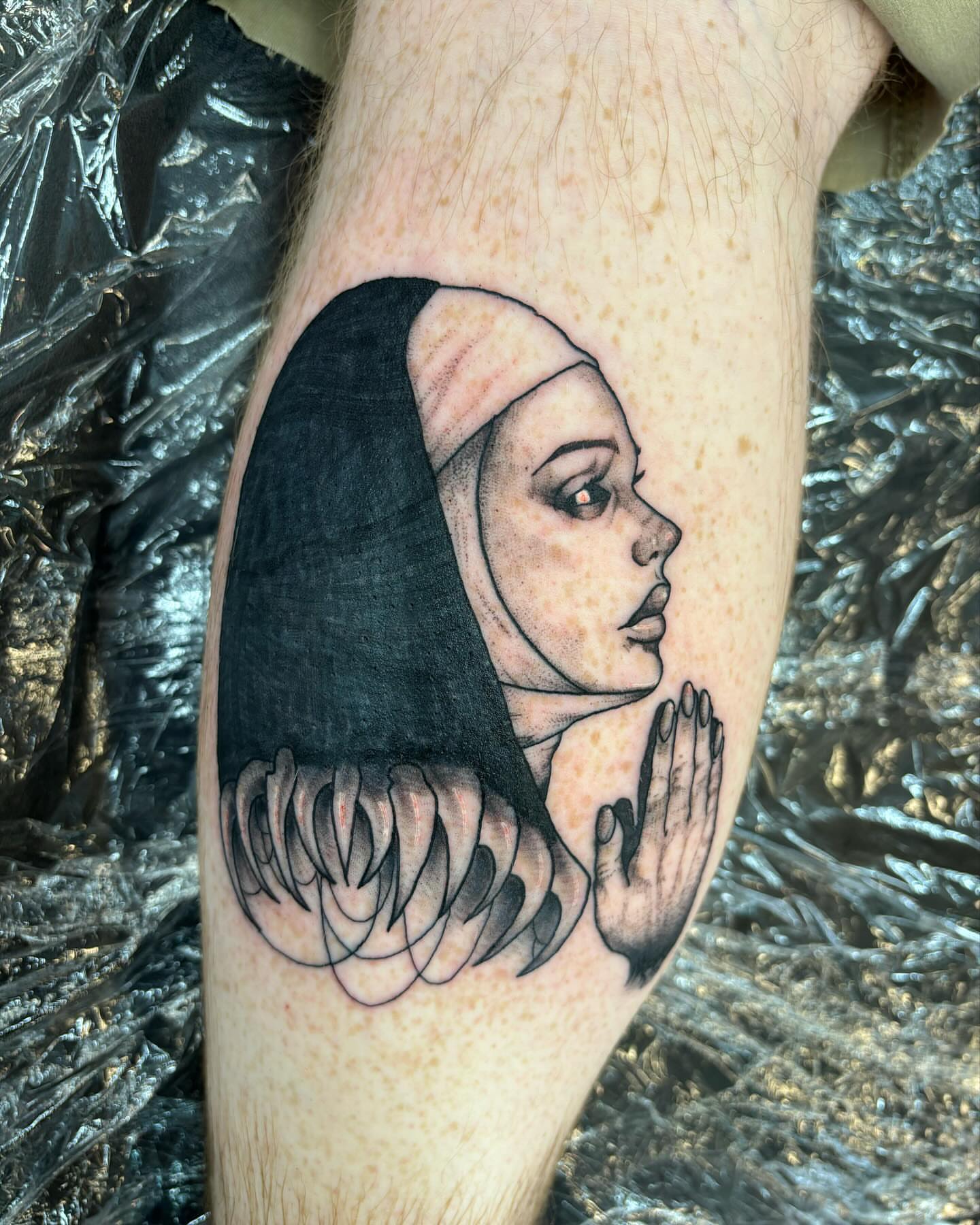 Woman praying realism tattoo on the forearm by kylie