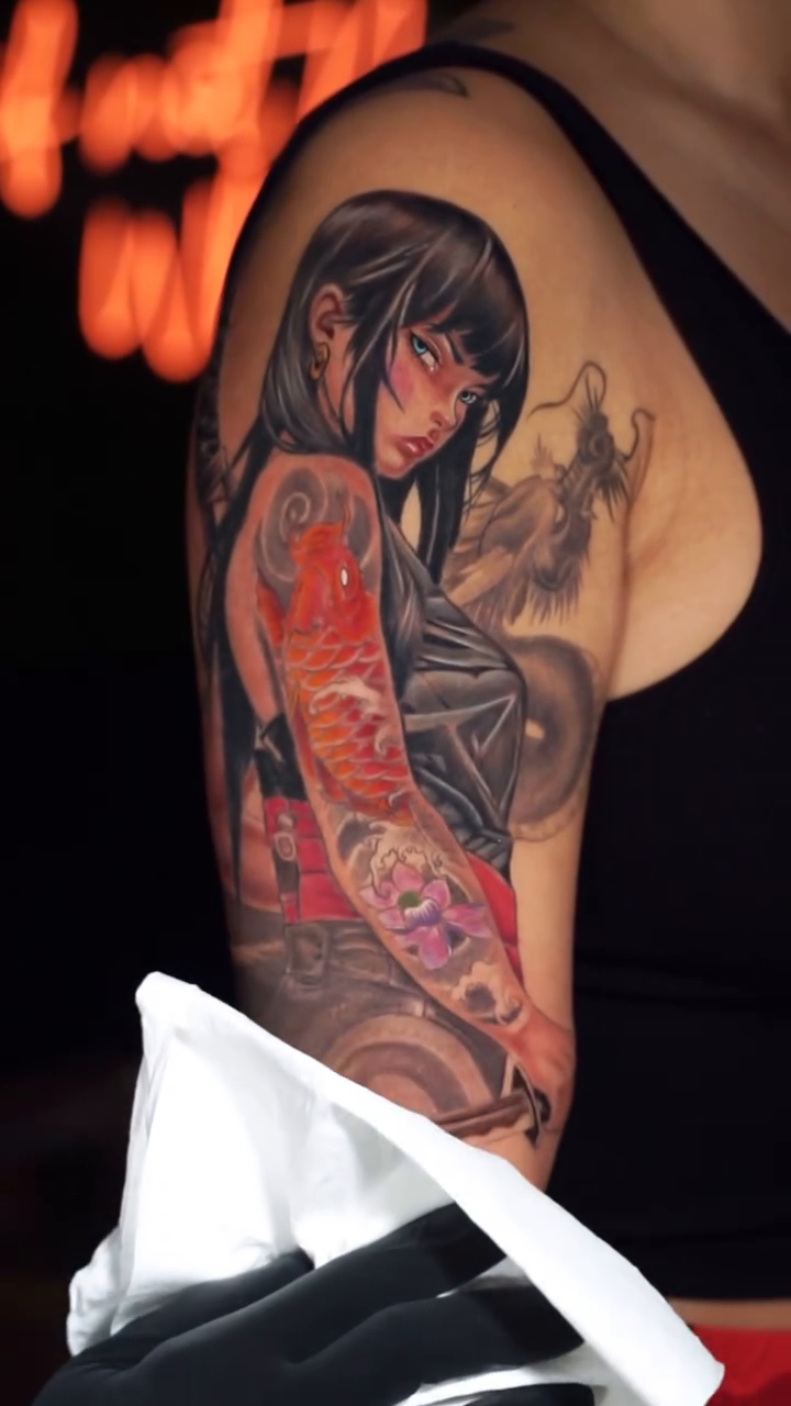 Woman with koi fish japanese irezumi tattoo by Amaury Ramirez
