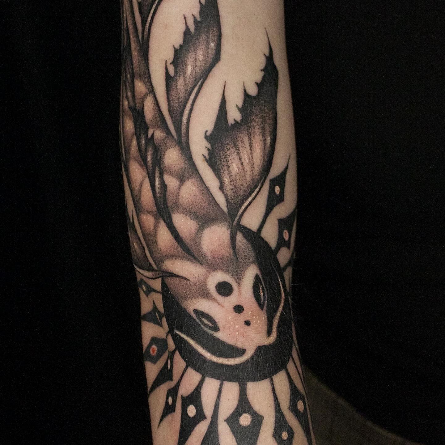 Dragon geometric tattoo on the forearm by Galen