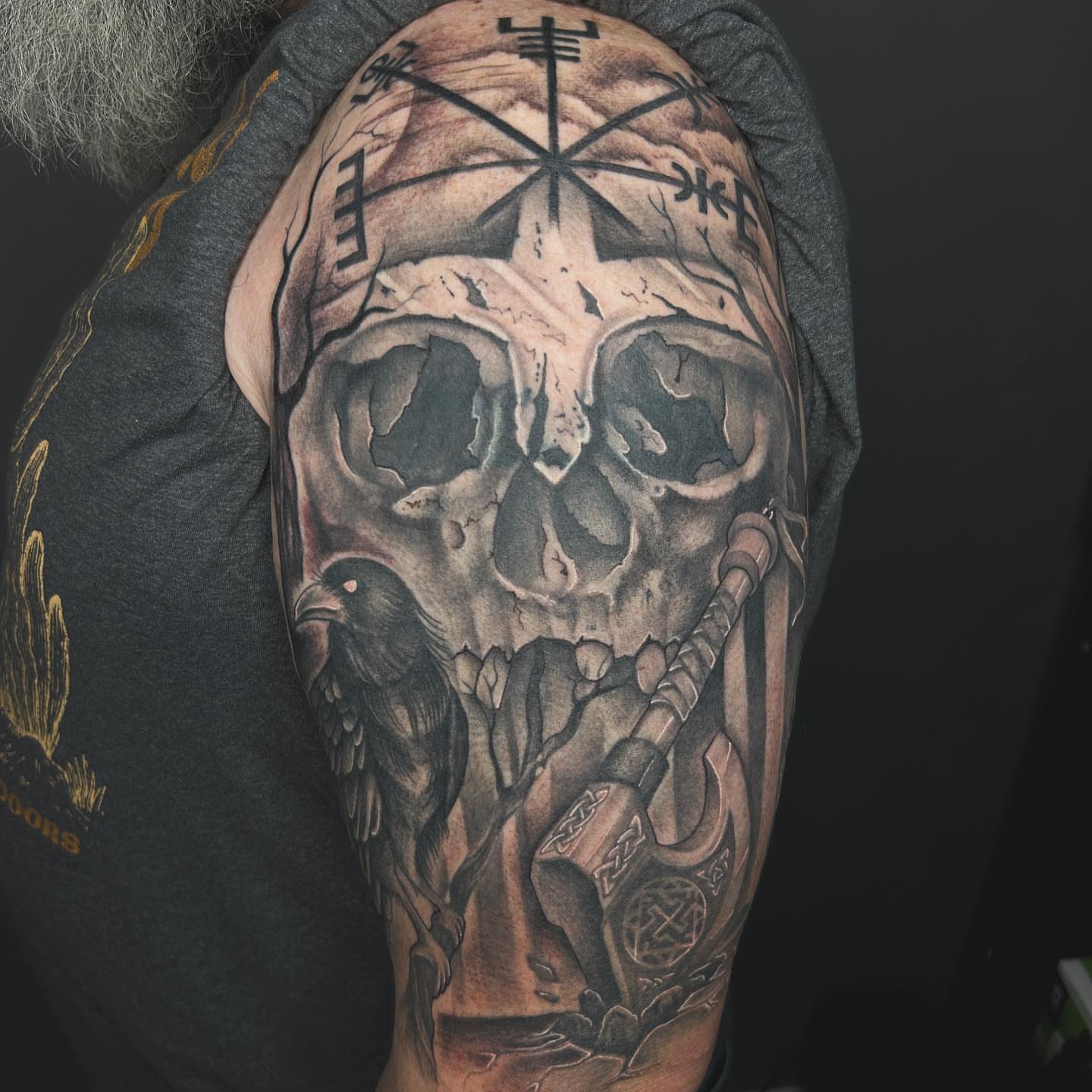 Skull and crow realism tattoo on the shoulder by Taylor Steckman