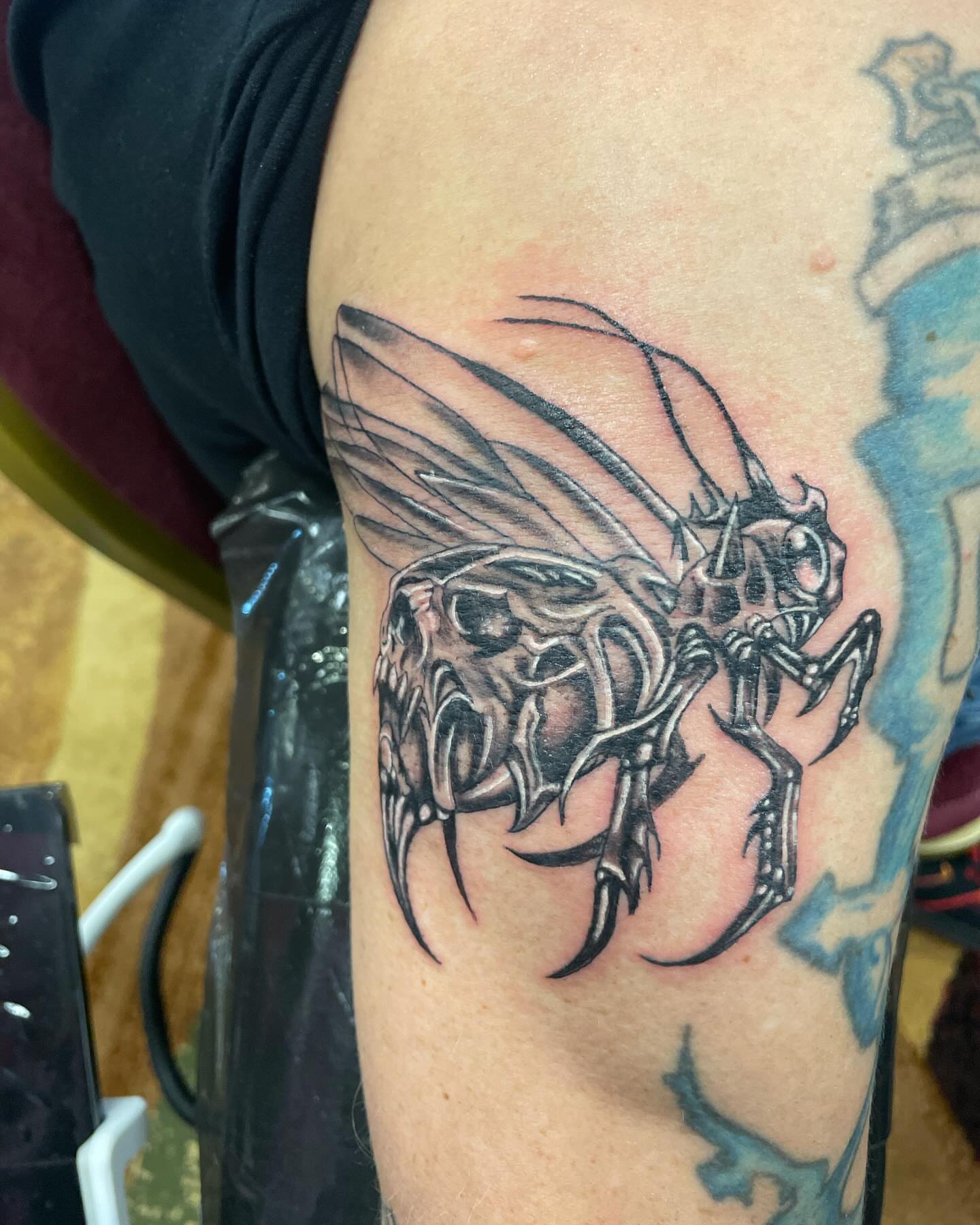 Insect black and grey tattoo on the forearm by Bryant Ramirez