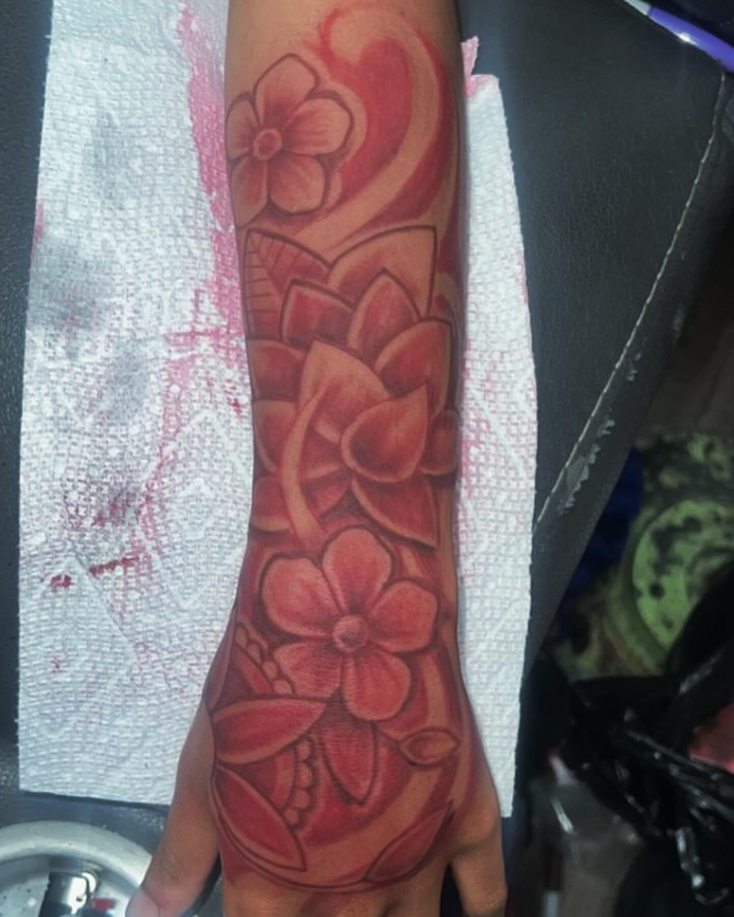Floral design American traditional tattoo on the forearm by Azaan (Zanye), Birmingham, Alabama