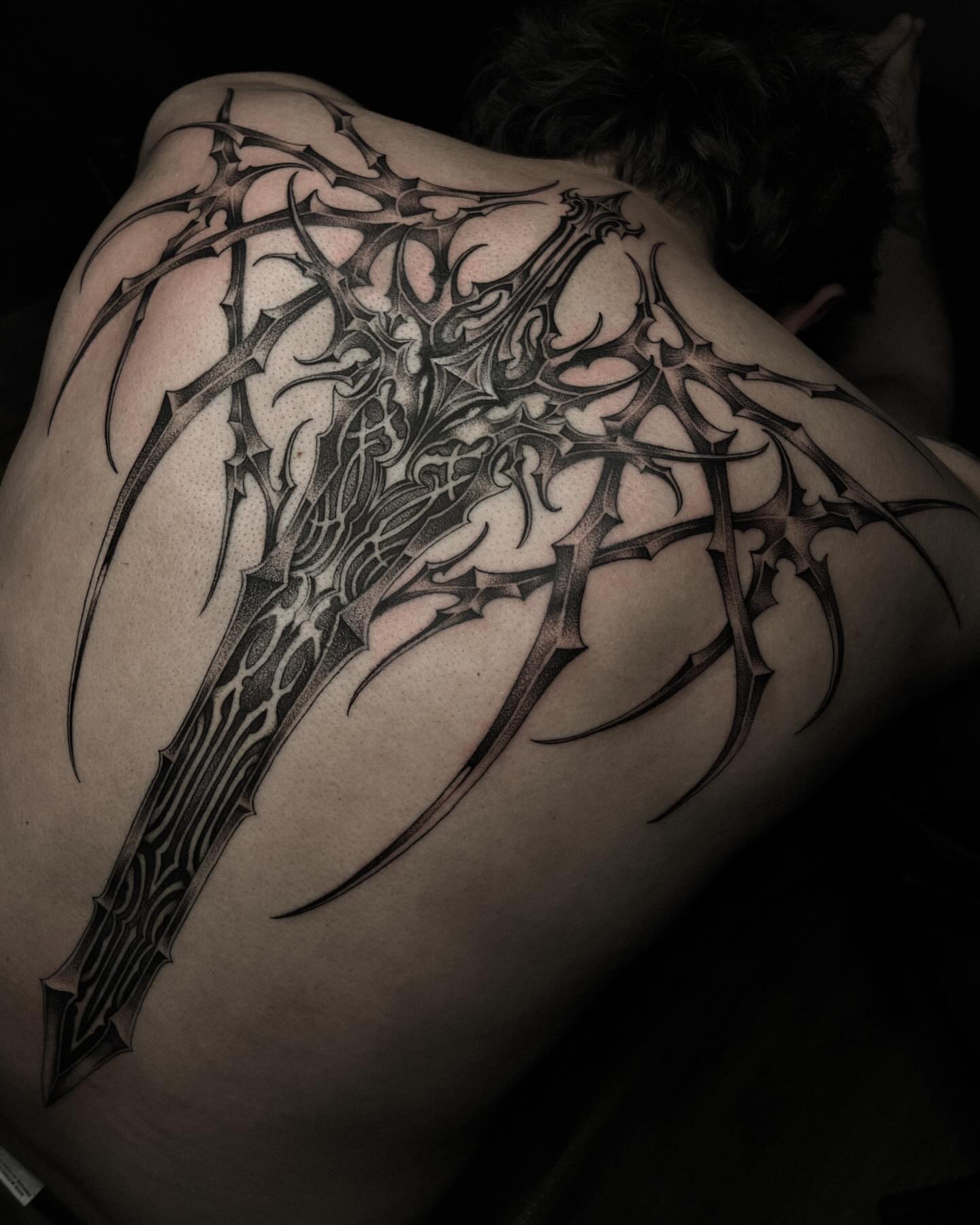 Thorned axe geometric tattoo on the back by David Ha