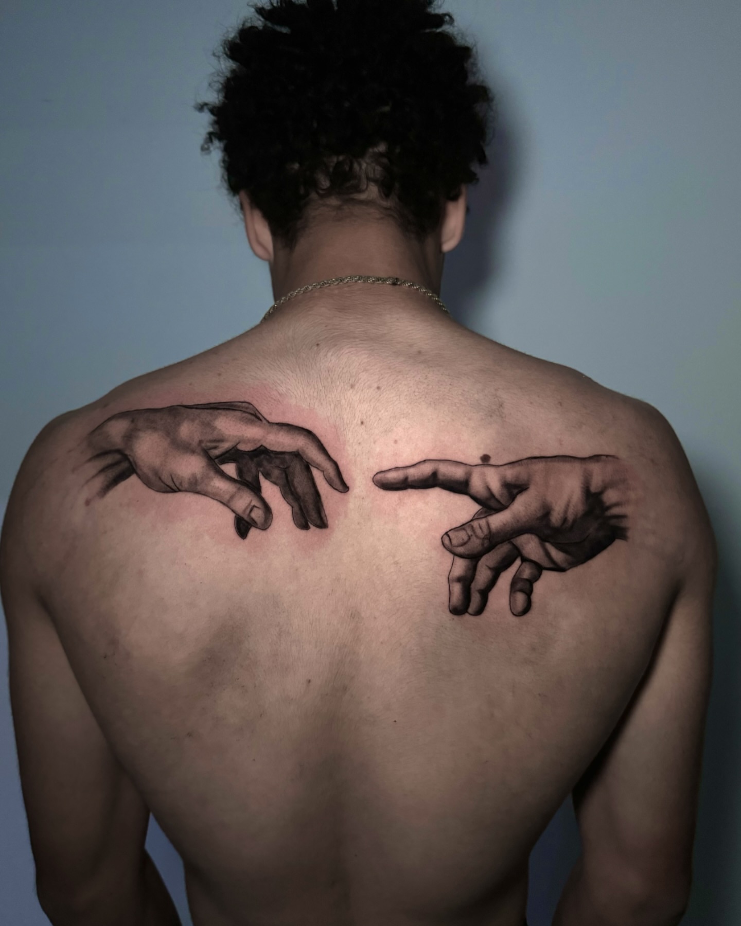 Hands realism tattoo on the back by Dallas Tattoo Artist