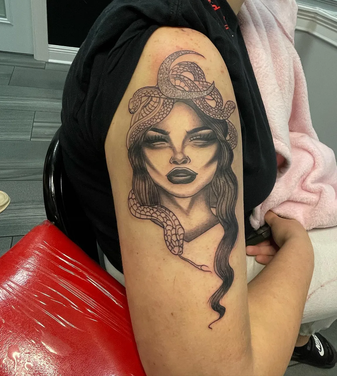 Woman with snakes realism tattoo on the shoulder by lizzy, Damascus, Maryland