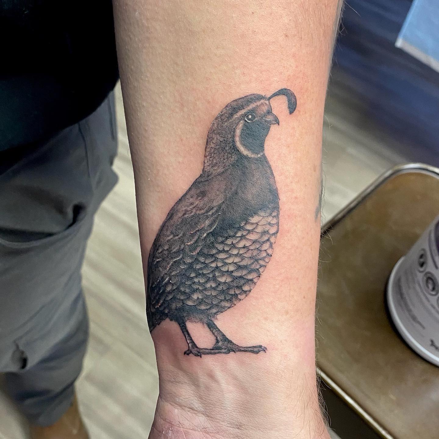 Quail realism tattoo on the forearm by Emily Conner