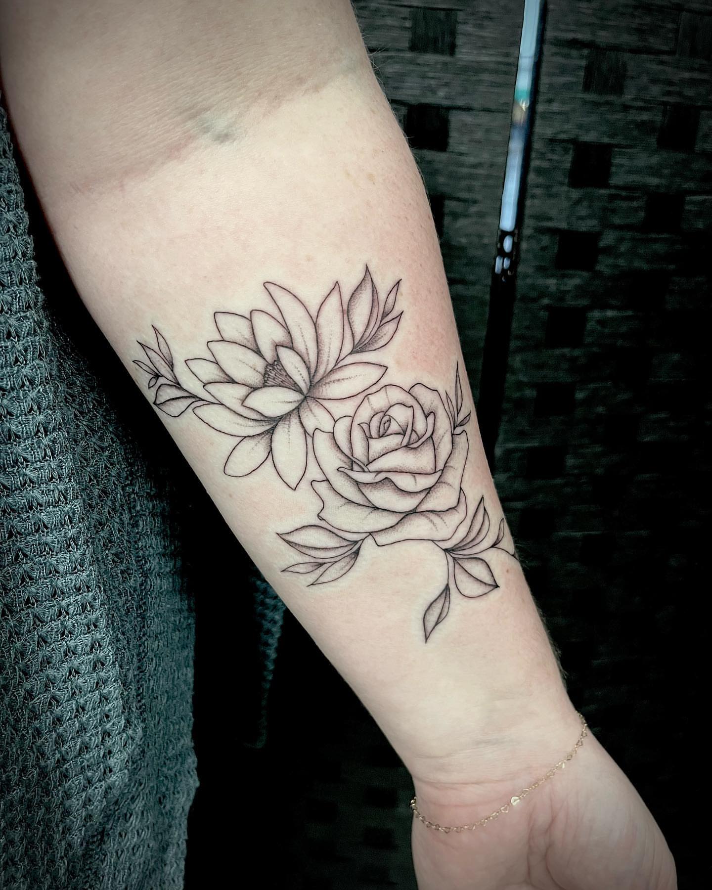 Floral bouquet black and grey tattoo on the forearm by oh hey, robin.
