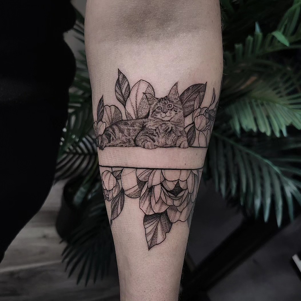 Cat and floral wreath dotwork tattoo on the forearm by Kyle Joseph [tattoo artist]