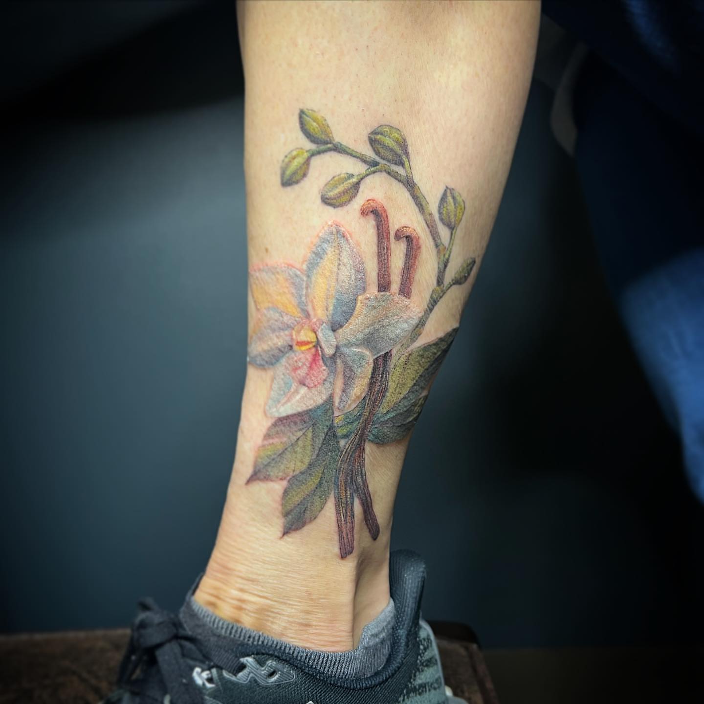 Orchid realism tattoo on the forearm by Sam Minter, Grafton, Massachusetts