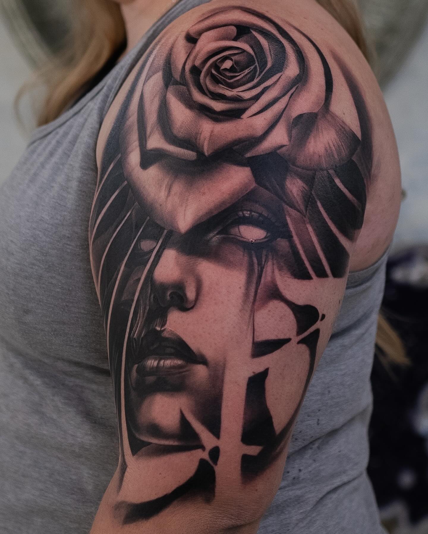 Woman's face with rose realism tattoo on the shoulder by Anthony Michaels, Tucson, Arizona