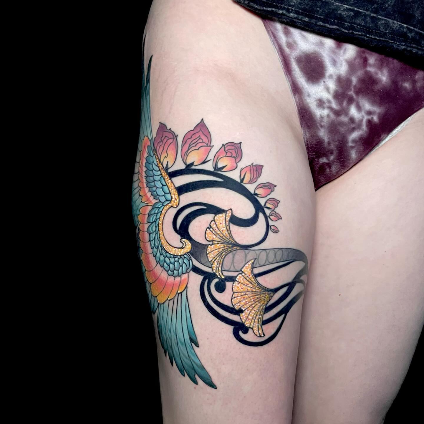 Bird and flowers new school tattoo on the thigh by Laura Babsie