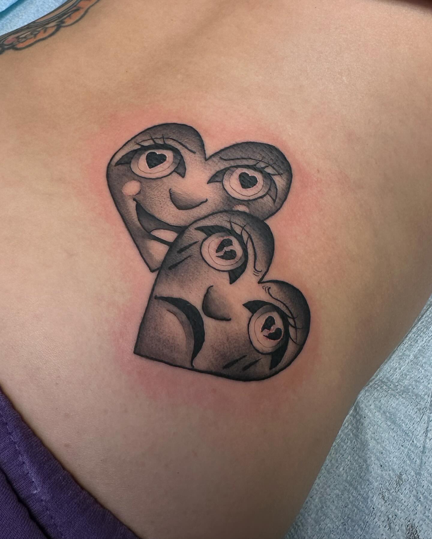 Heart black and grey tattoo on the chest by Juan Vega (tony)