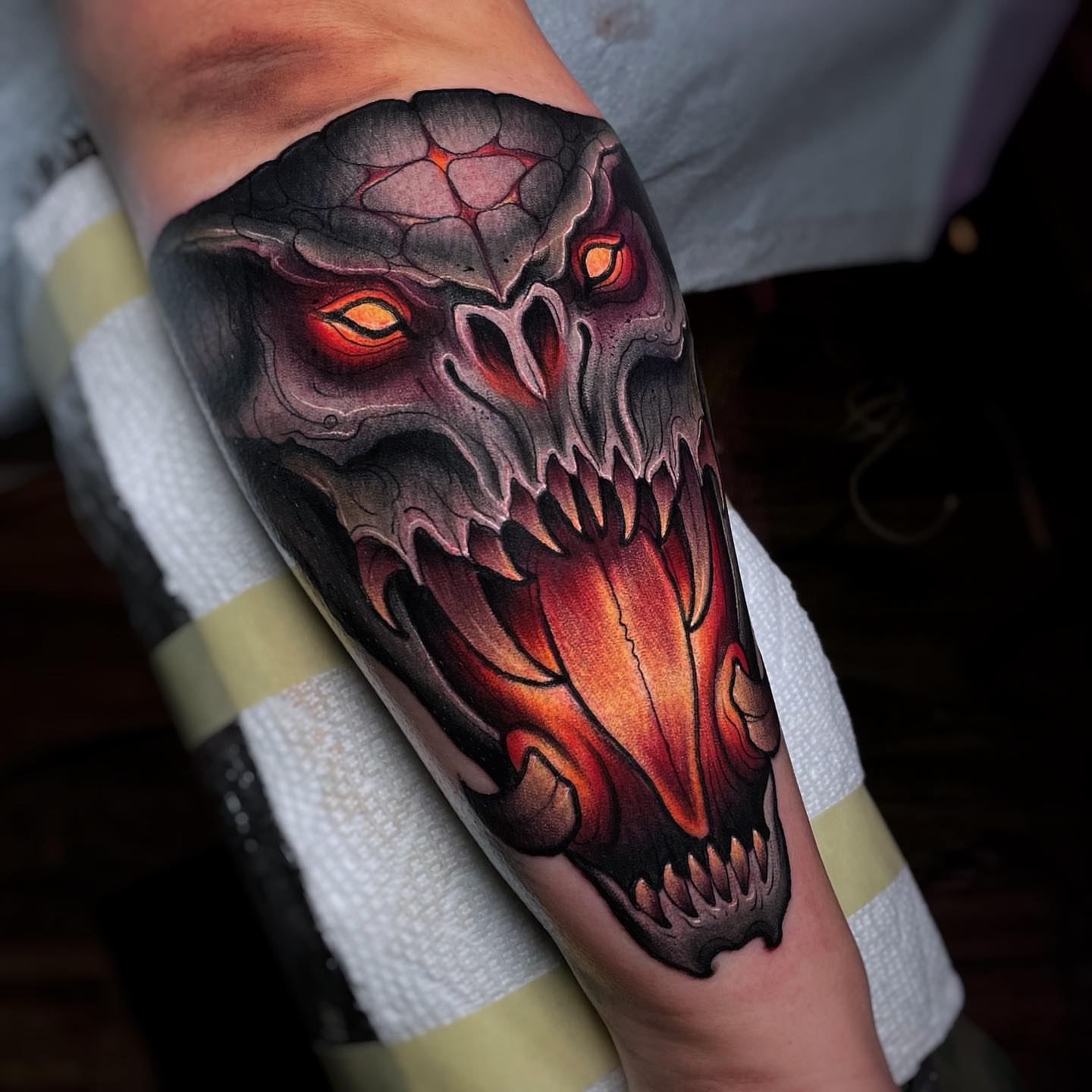 Demon skull dark realism tattoo on the forearm by Ick Abrams