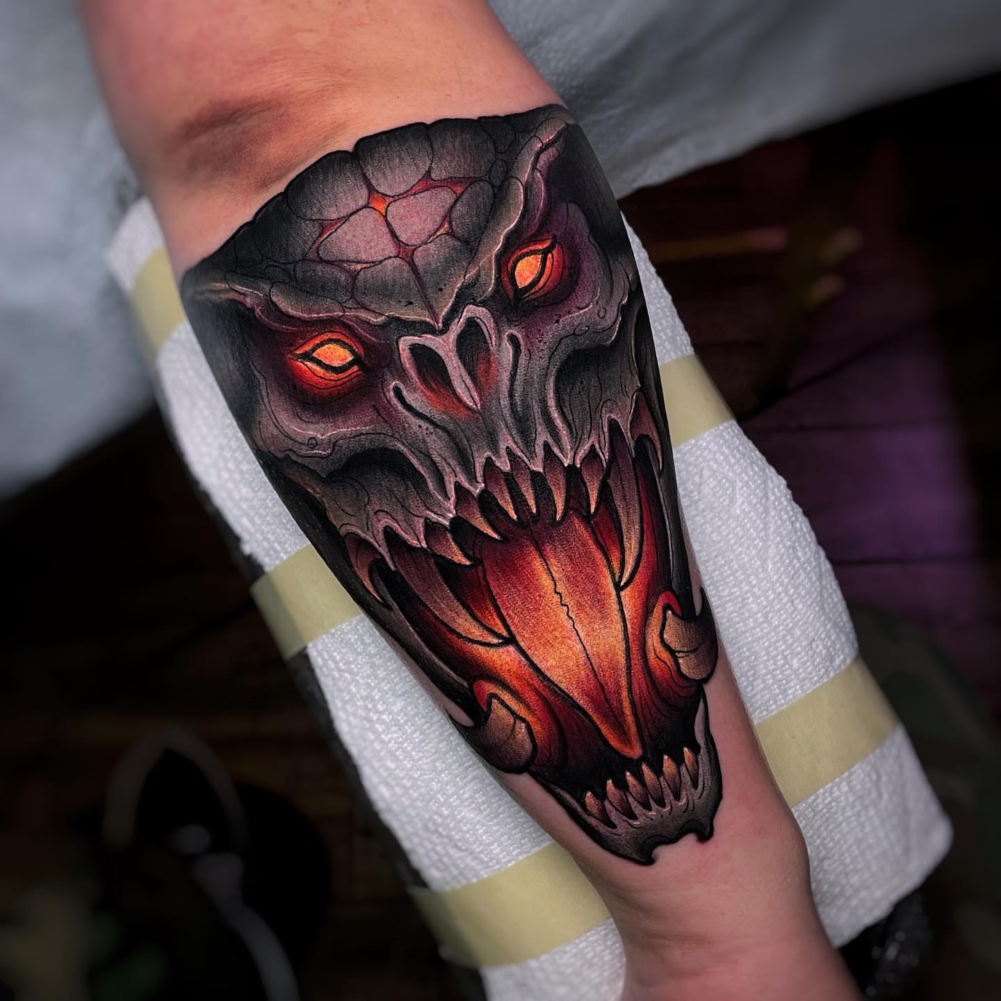 Demon skull dark realism tattoo on the forearm by Ick Abrams