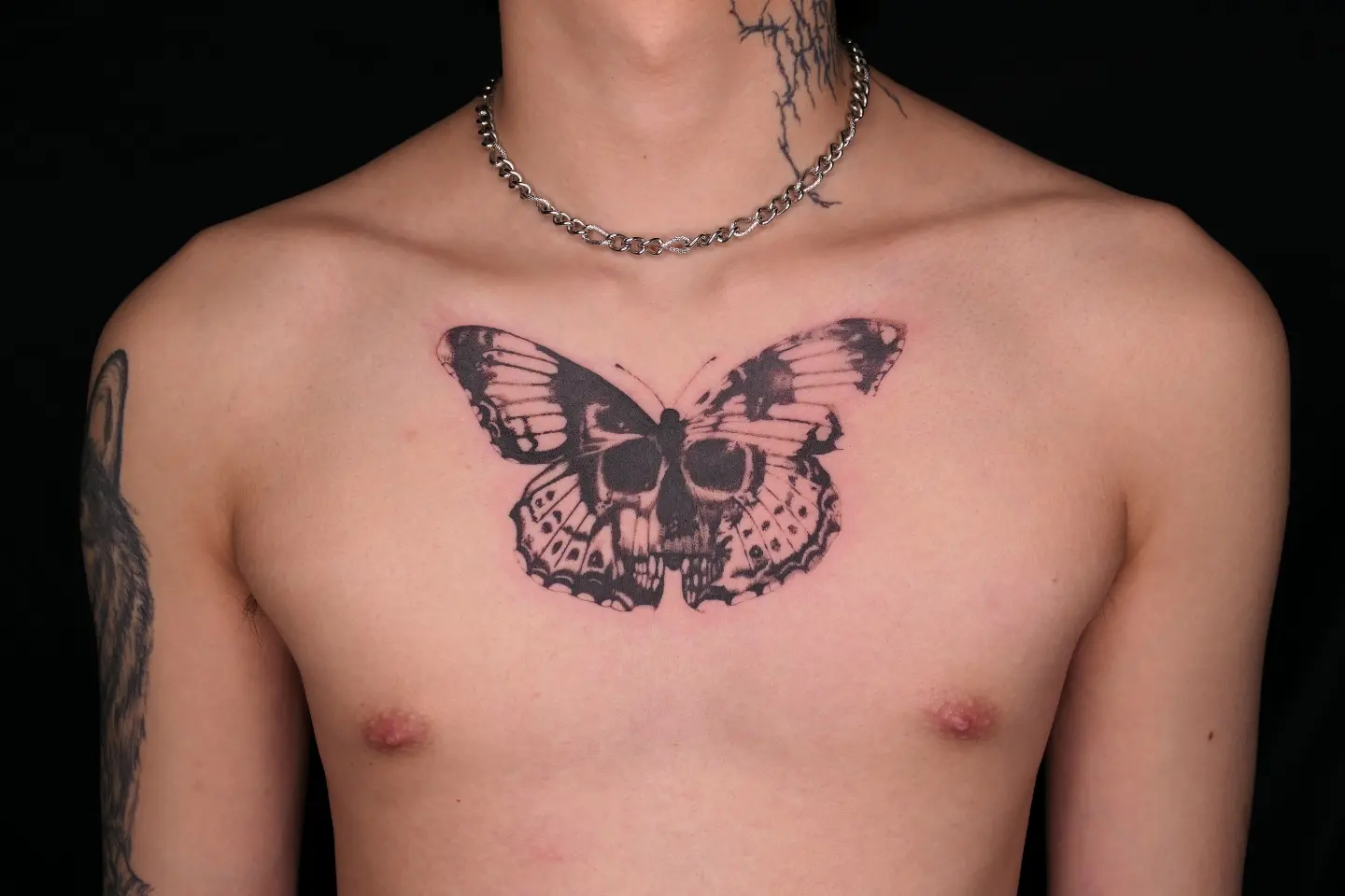 Butterfly skull black and grey tattoo on the chest by 𝑴𝒆𝒍𝒐
