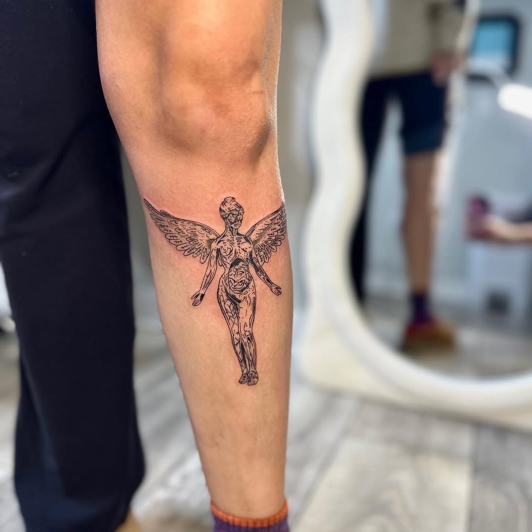 Winged figure realism tattoo on the forearm by brinley - fine line tattoos, Crescent Springs, Kentucky