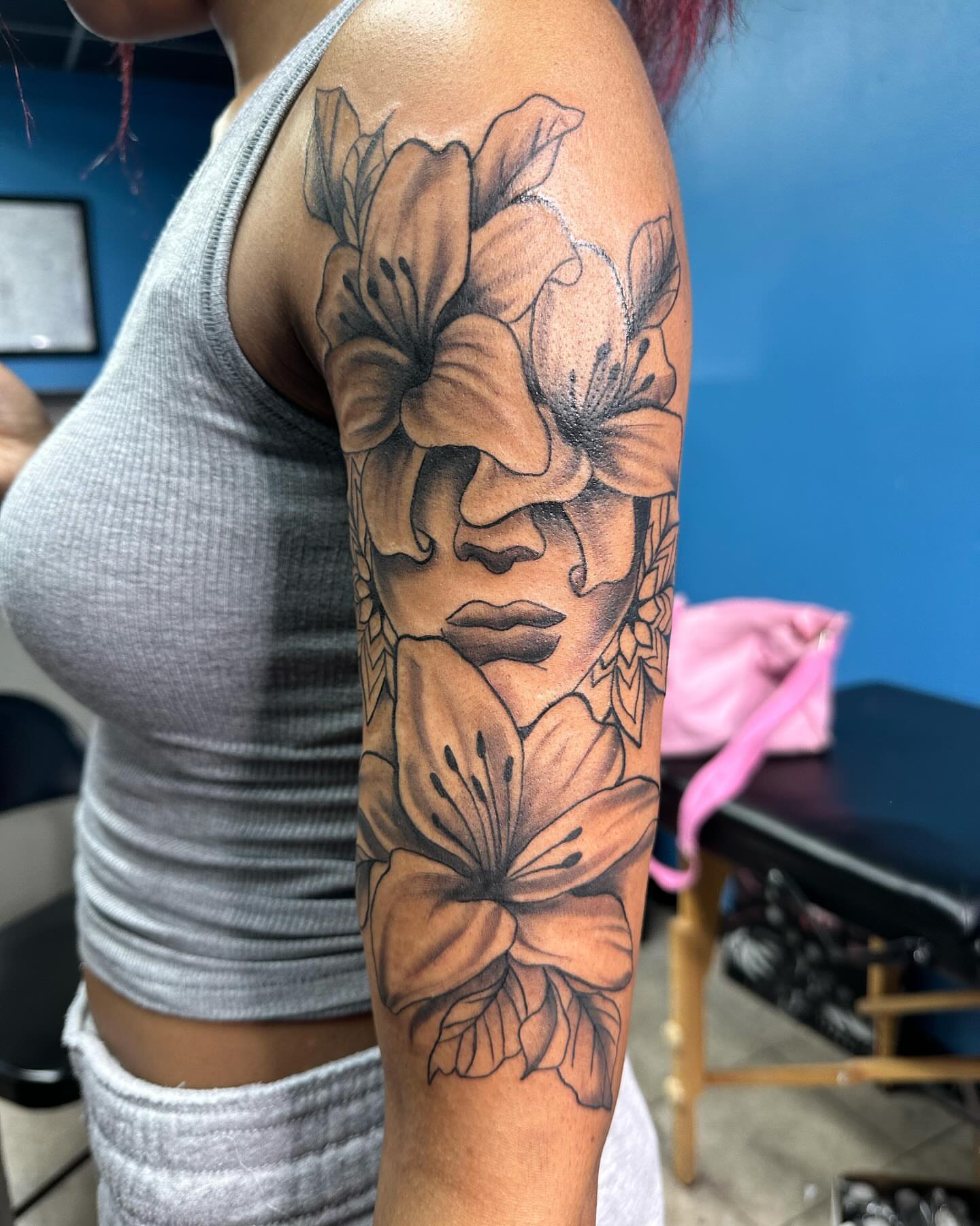 Floral portrait realism tattoo on the forearm by Mr. Tatt2Junkiee 💉🧟