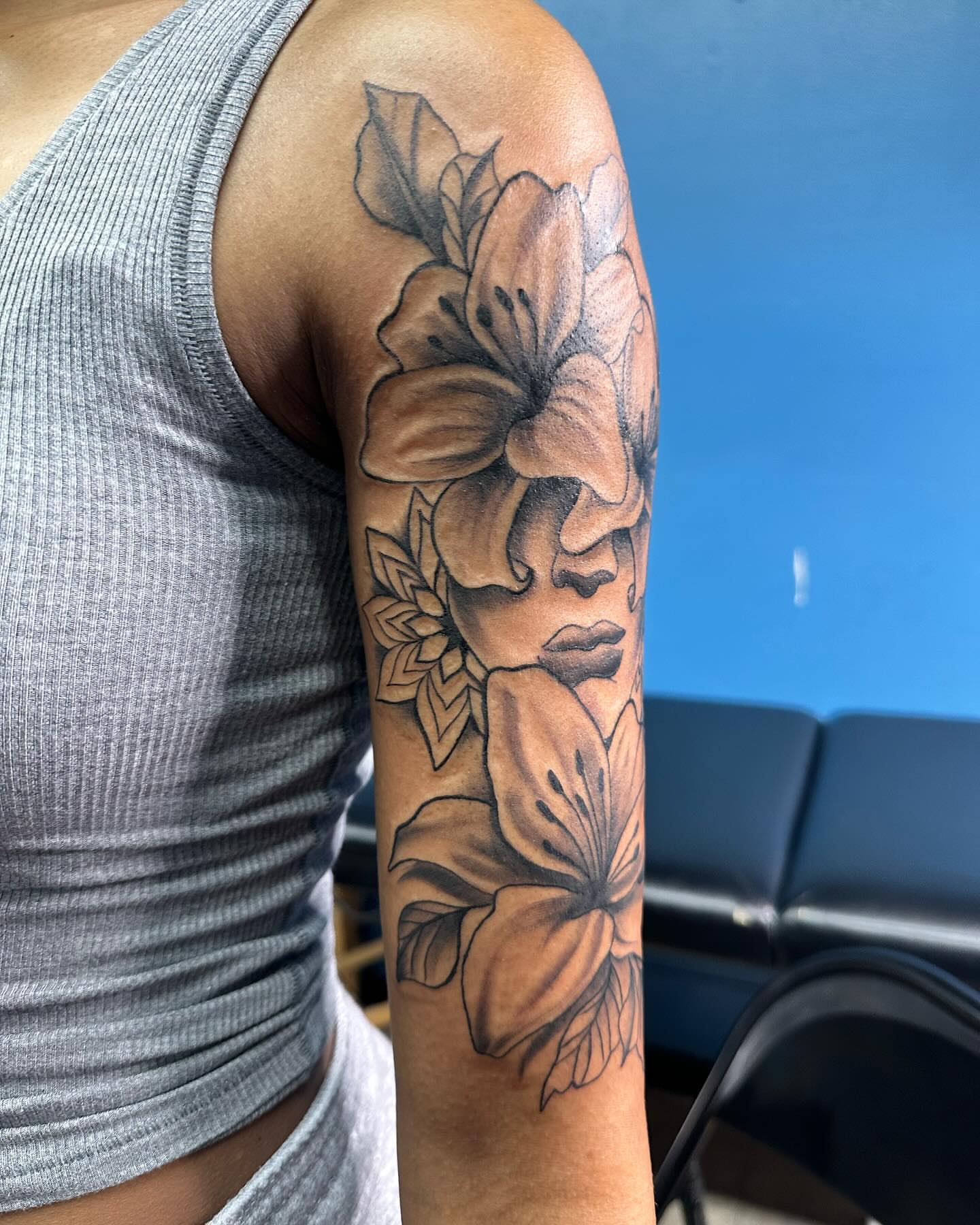 Floral portrait realism tattoo on the forearm by Mr. Tatt2Junkiee 💉🧟