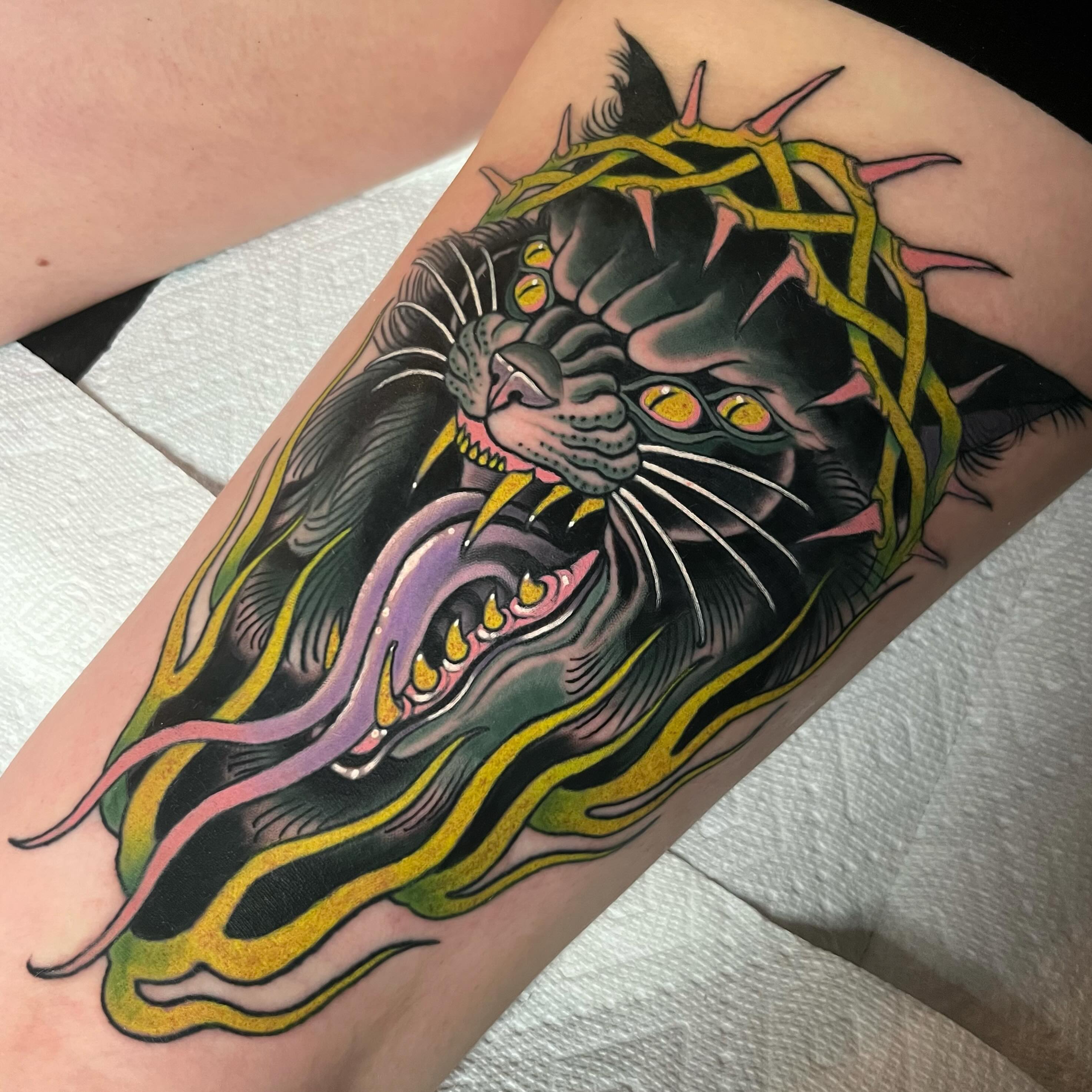 Panther American traditional tattoo on the forearm by Sara Lewis