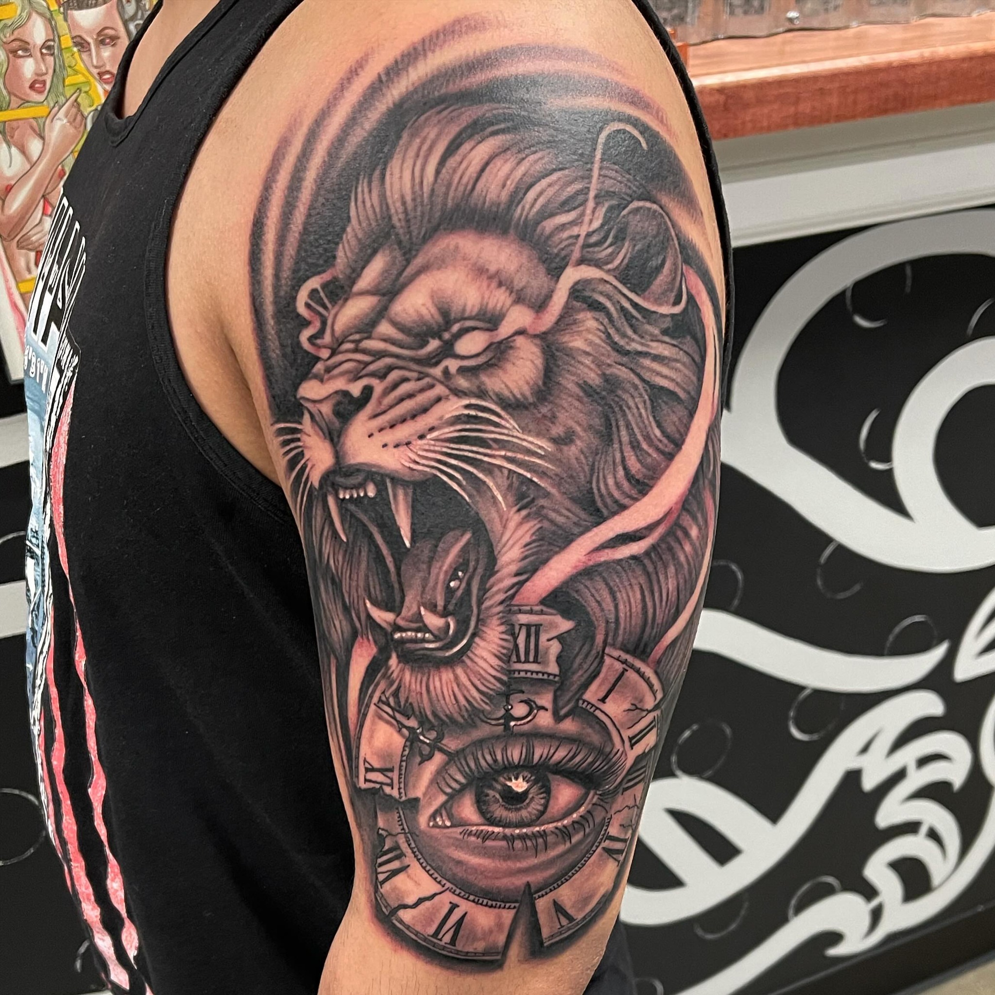 Lion and clock realism tattoo on the forearm by David Gottschalk