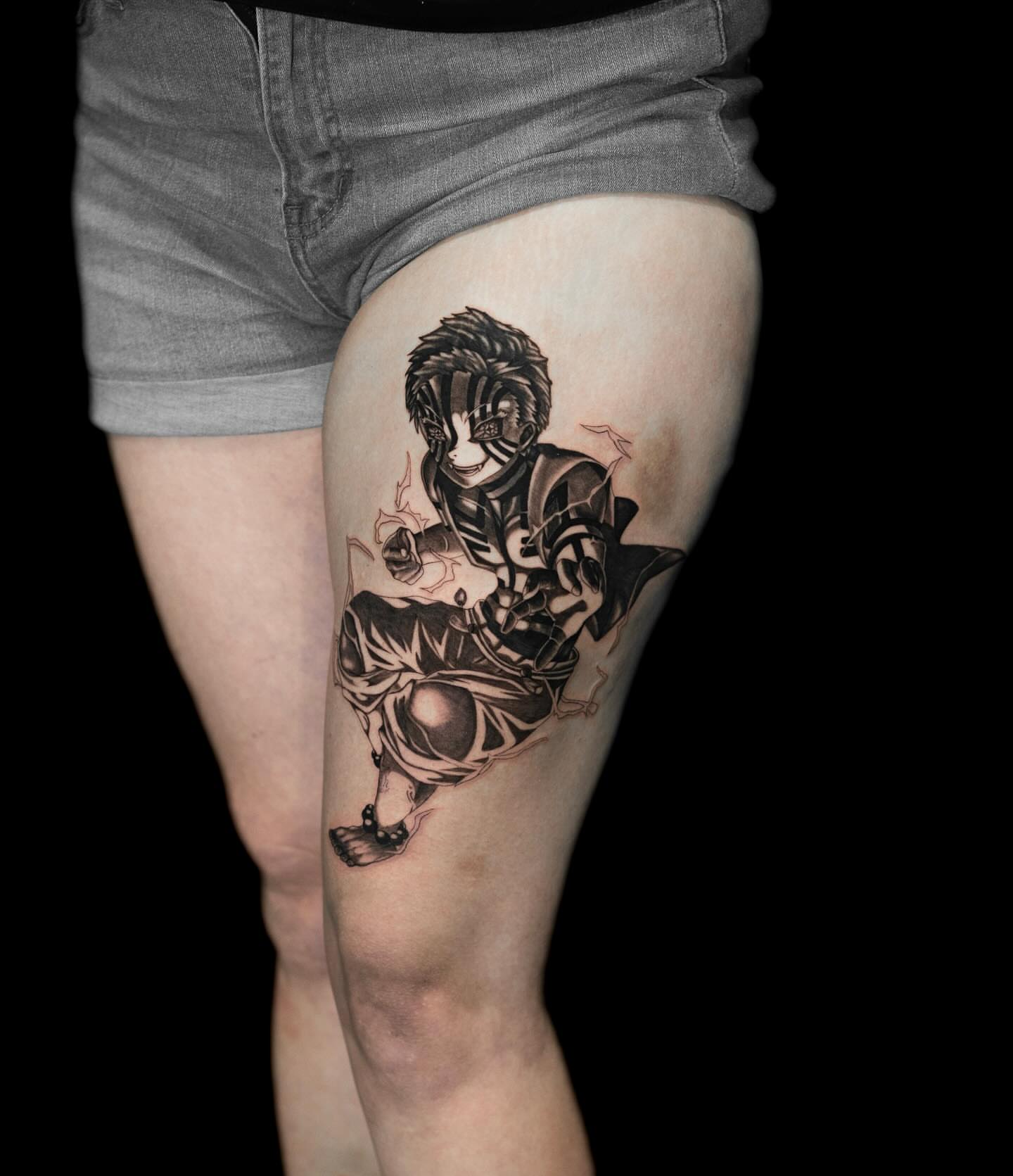Anime character anime tattoo on the thigh by Tattoo Artist
