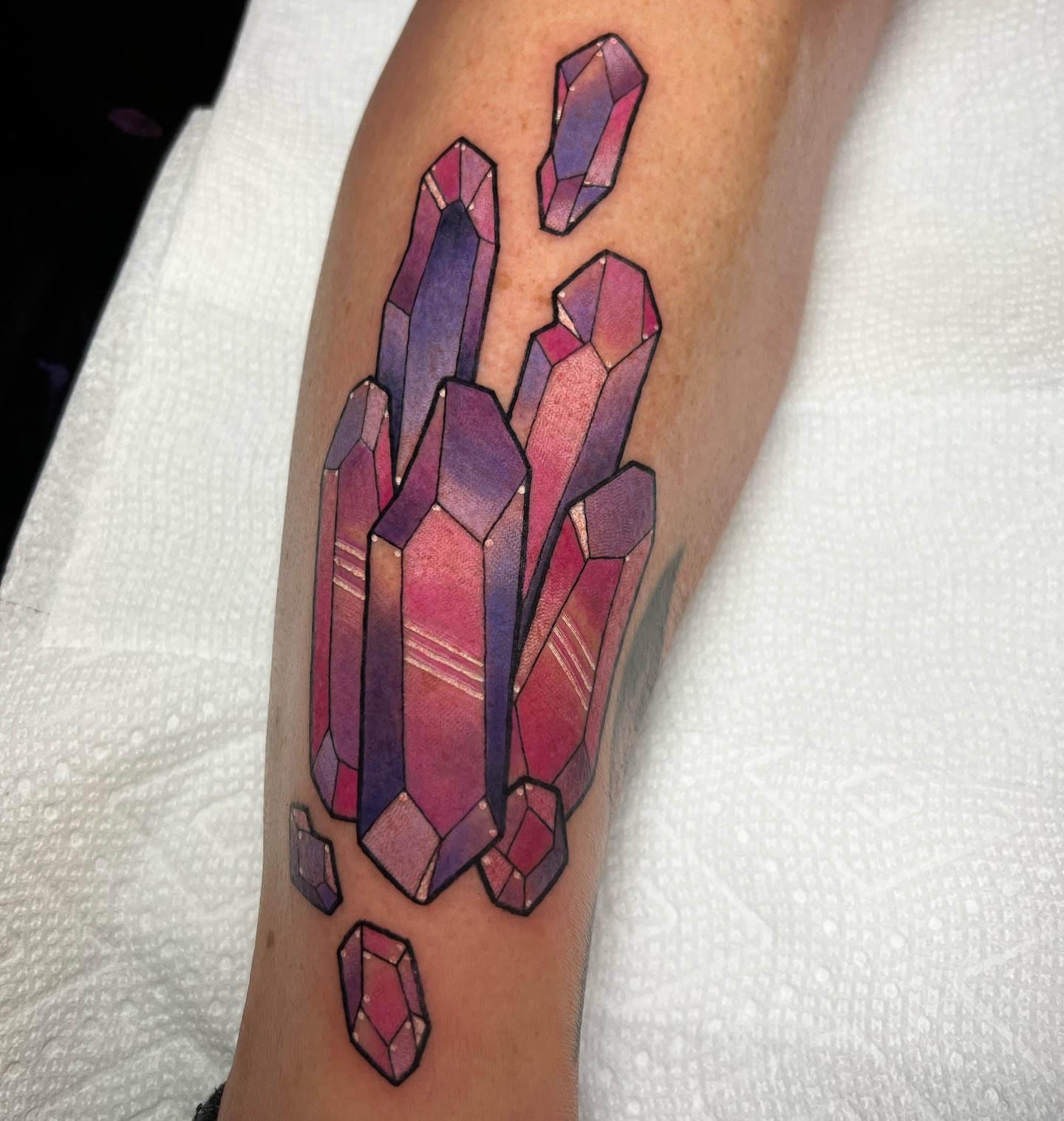 Crystal cluster watercolor tattoo on the forearm by ๐ฎ๐๐๐๐๐๐