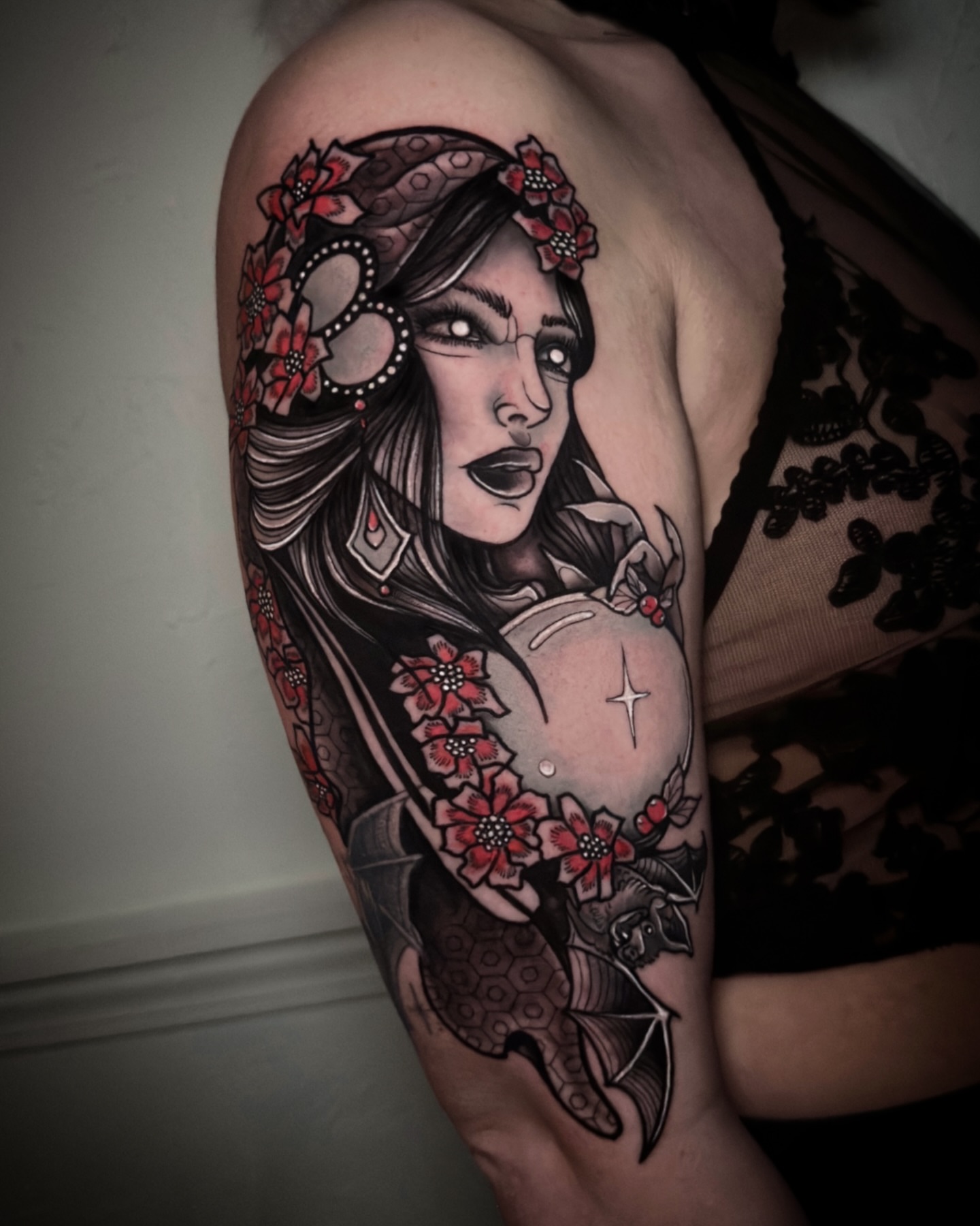 Woman with flowers American traditional tattoo on the shoulder by Naysla Droguett