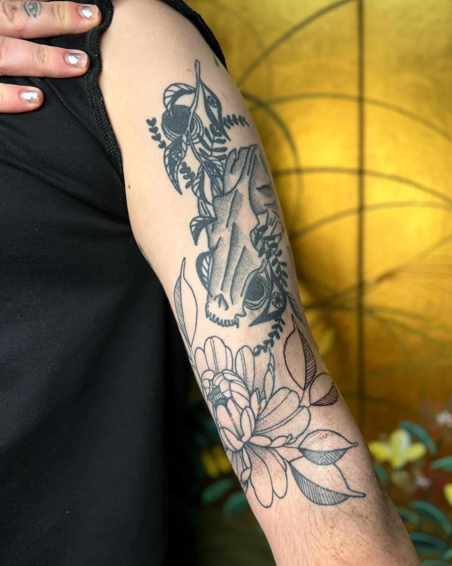 Flower and bird black and grey tattoo on the forearm by Mazie