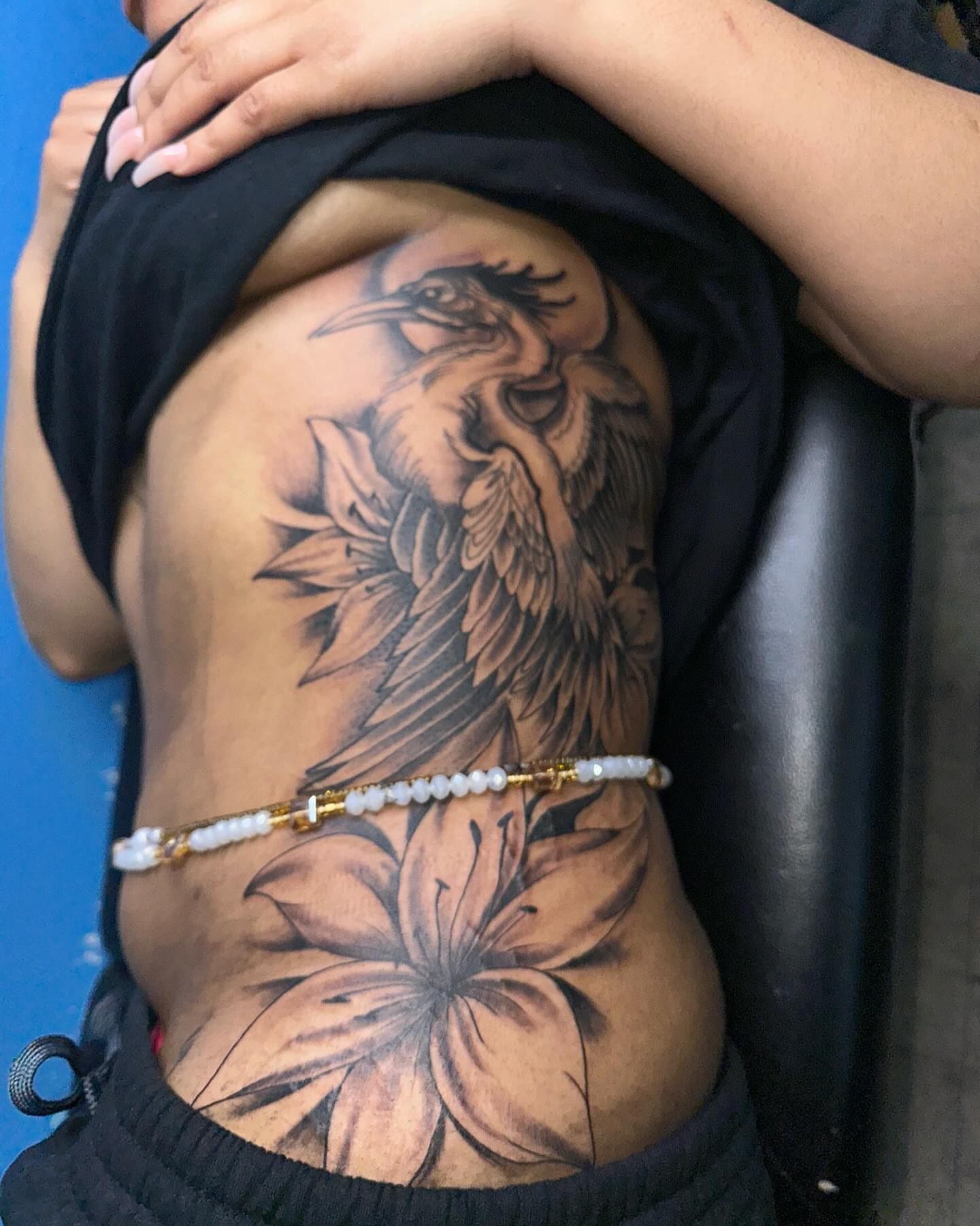 Heron and lily realism tattoo on the ribs by Mr. Tatt2Junkiee 💉🧟