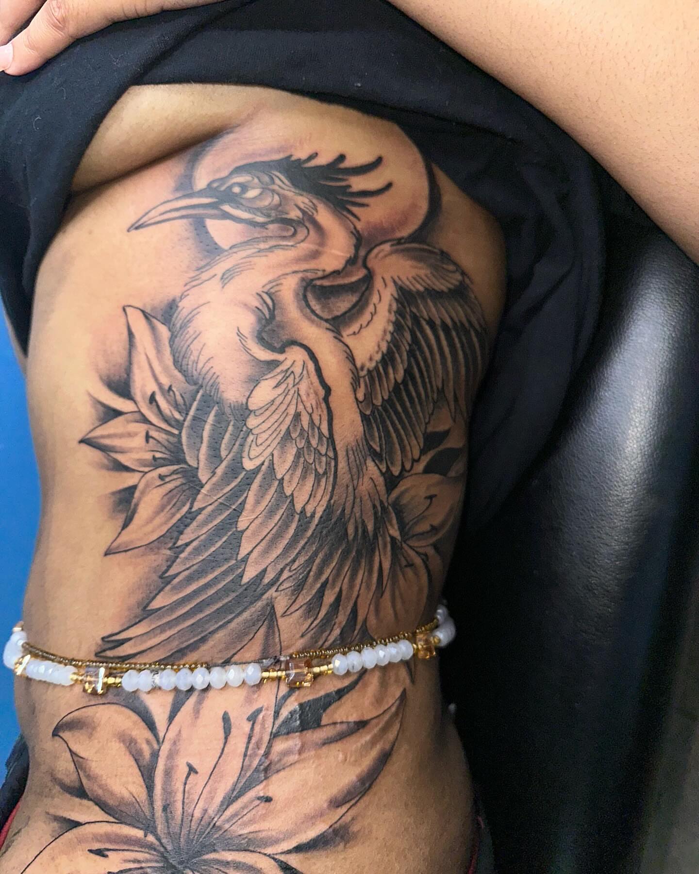 Bird and flower realism tattoo on the thigh by Mr. Tatt2Junkiee 💉🧟
